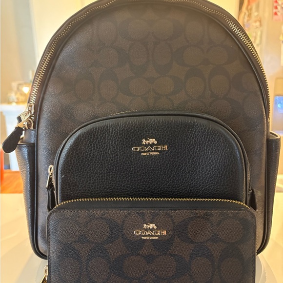 Coach backpack and matching wallet slightly used but only
Used a few times - Picture 1 of 3
